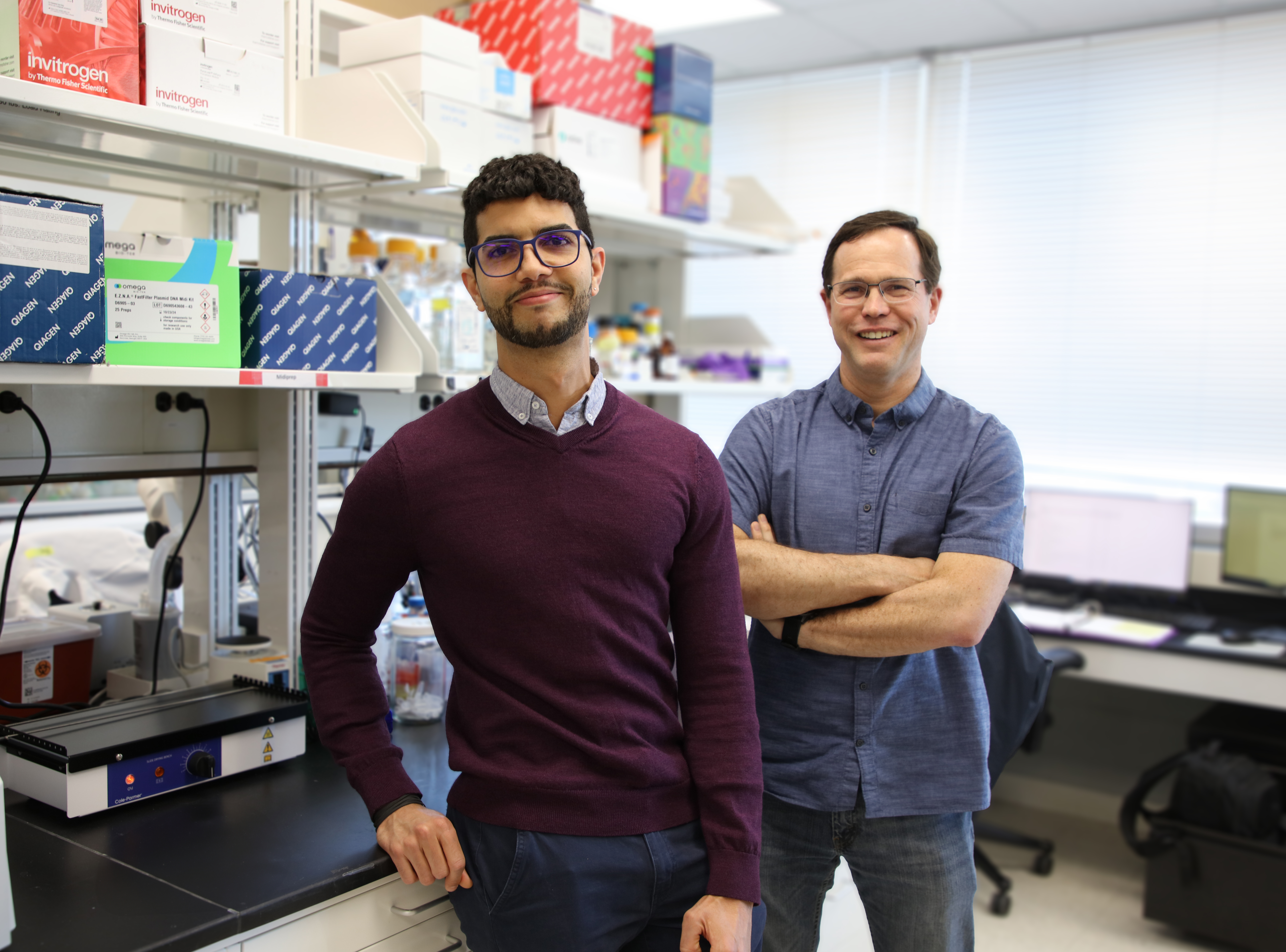 Jesus Garcia Lerena and Dr. Eran Andrechek poses in a lab.