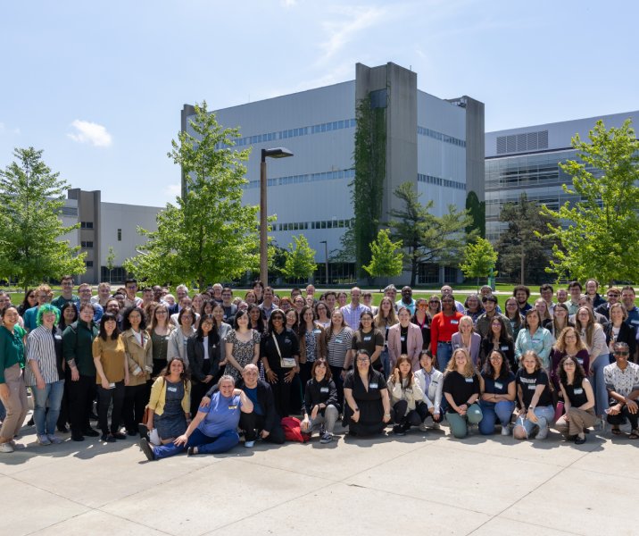 Sunny day outside group photo of around fifty students